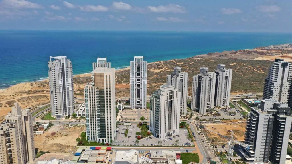 Aerial view of Ir Yamim, Netanya, and the Mediterranean coastline with YAMA towers (developer rendering)